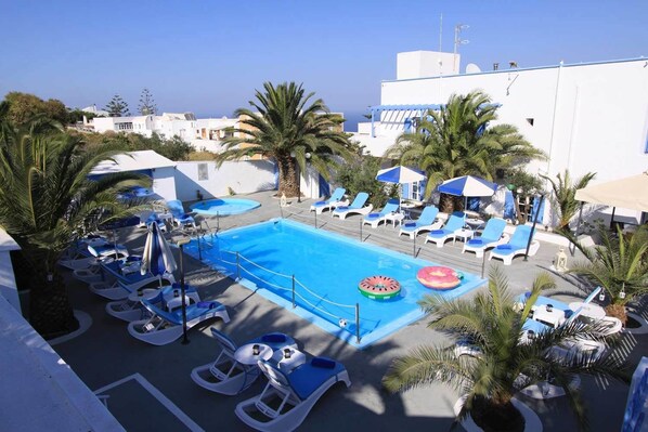 Outdoor pool, open 8 AM to 9 PM, pool umbrellas, sun loungers