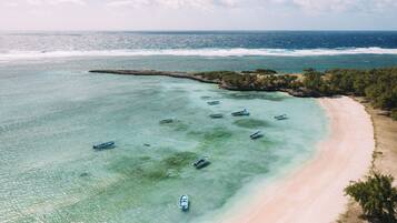 On the beach, white sand, beach towels, scuba diving