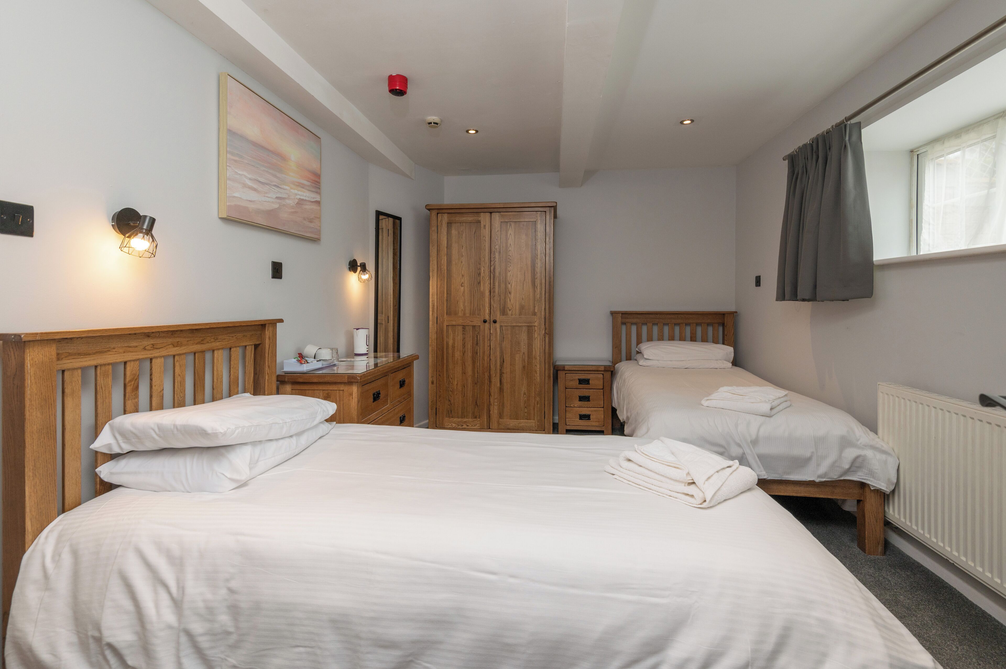 standard twin room | premium bedding, select comfort beds, desk, blackout curtains