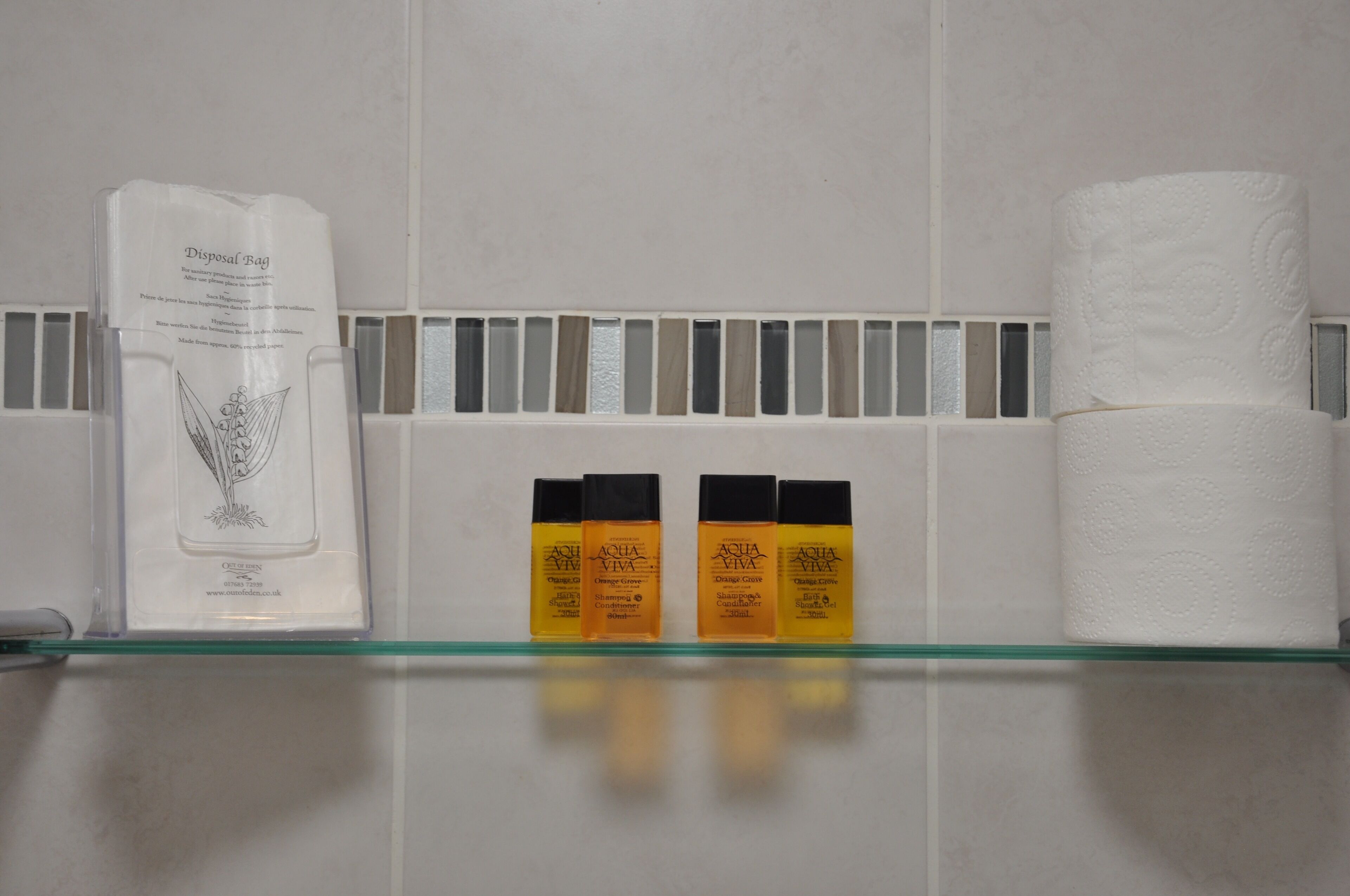 shower, hair dryer, towels, shampoo