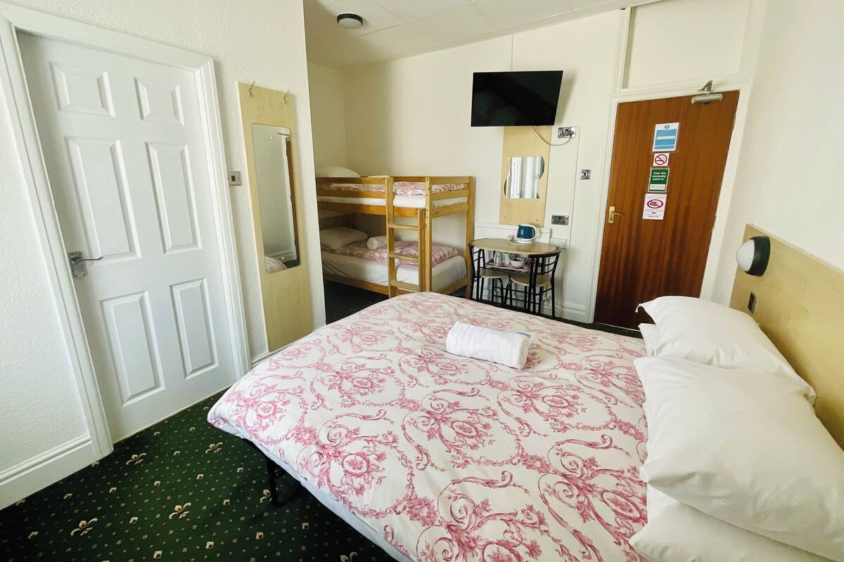 Economy Quadruple Room | 1 bedroom, in-room safe, iron/ironing board, free WiFi