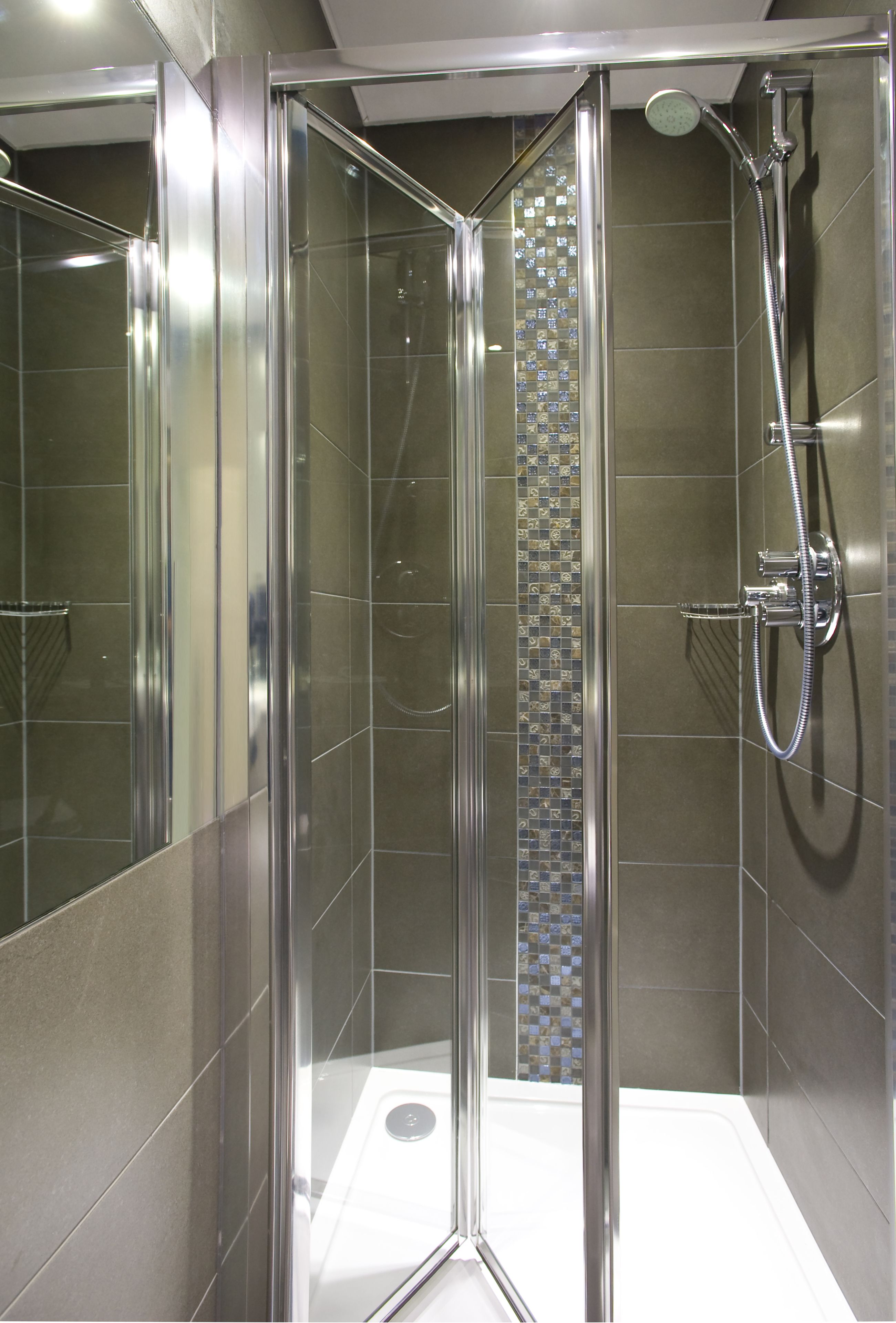 shower, designer toiletries, hair dryer, towels