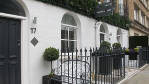 A building with a sign reading "Alhambra Hotel" and the number "17" on the door. - Alhambra Hotel (London)