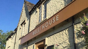 A stone building with a sign reading "BELL HOUSE." - Bell House Hotel & Restaurant (Chippenham)