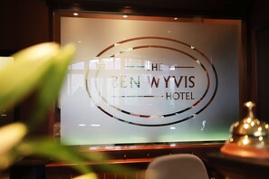 A hotel sign with the name "The Ben Wyvis Hotel" and a circular design element. - Ben Wyvis Hotel (Strathpeffer)