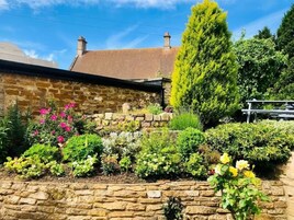 Hypo-allergenic bedding, desk, laptop workspace, blackout drapes