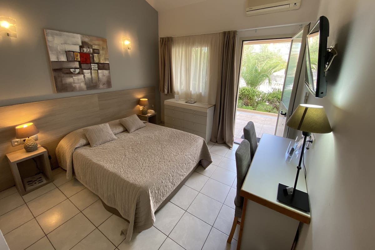 Family Quadruple Room, Terrace, Ground Floor | Premium bedding, individually decorated, individually furnished, desk