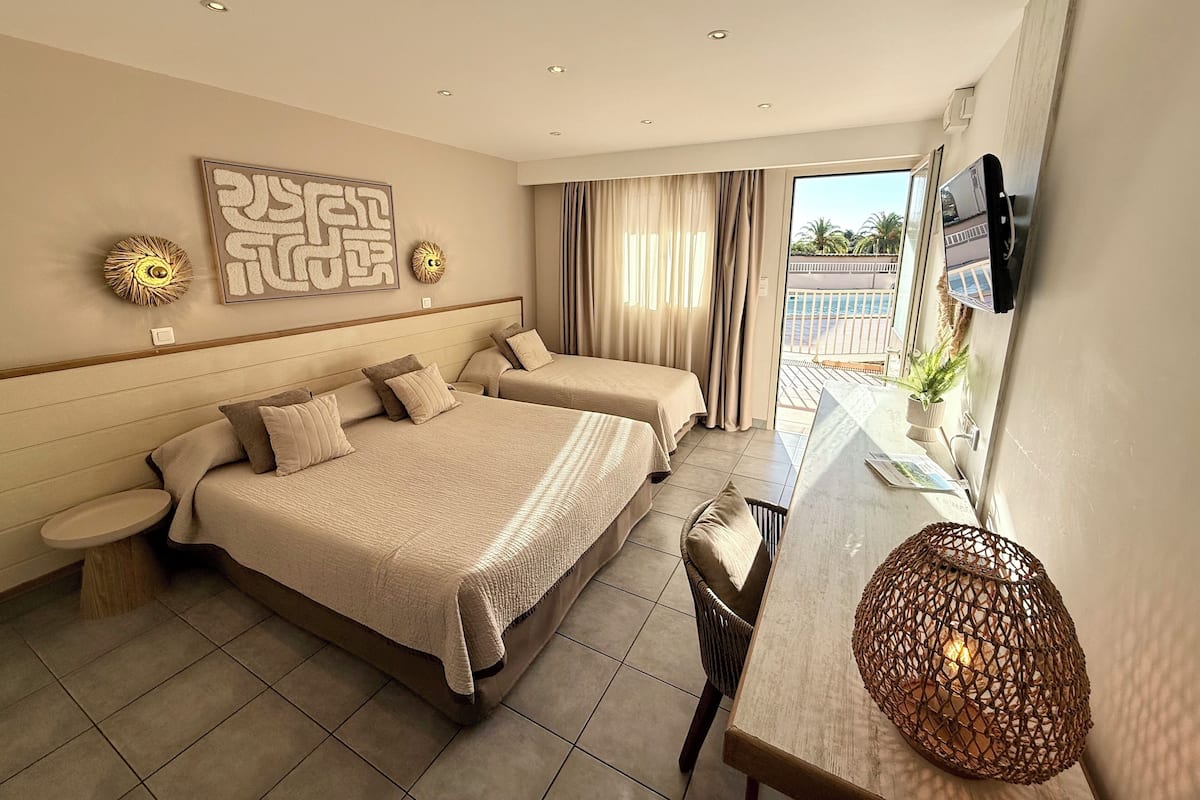 Superior Triple Room, Terrace, Ground Floor | Premium bedding, desk, laptop workspace, blackout drapes