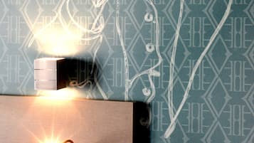 A wall with a geometric pattern and a line drawing of a person.