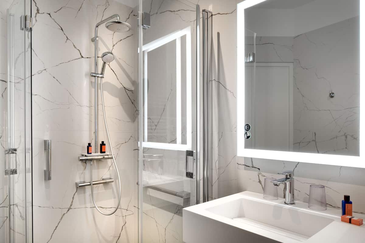 superior room (manoir ground floor) | bathroom | free toiletries, hair dryer, bathrobes, slippers