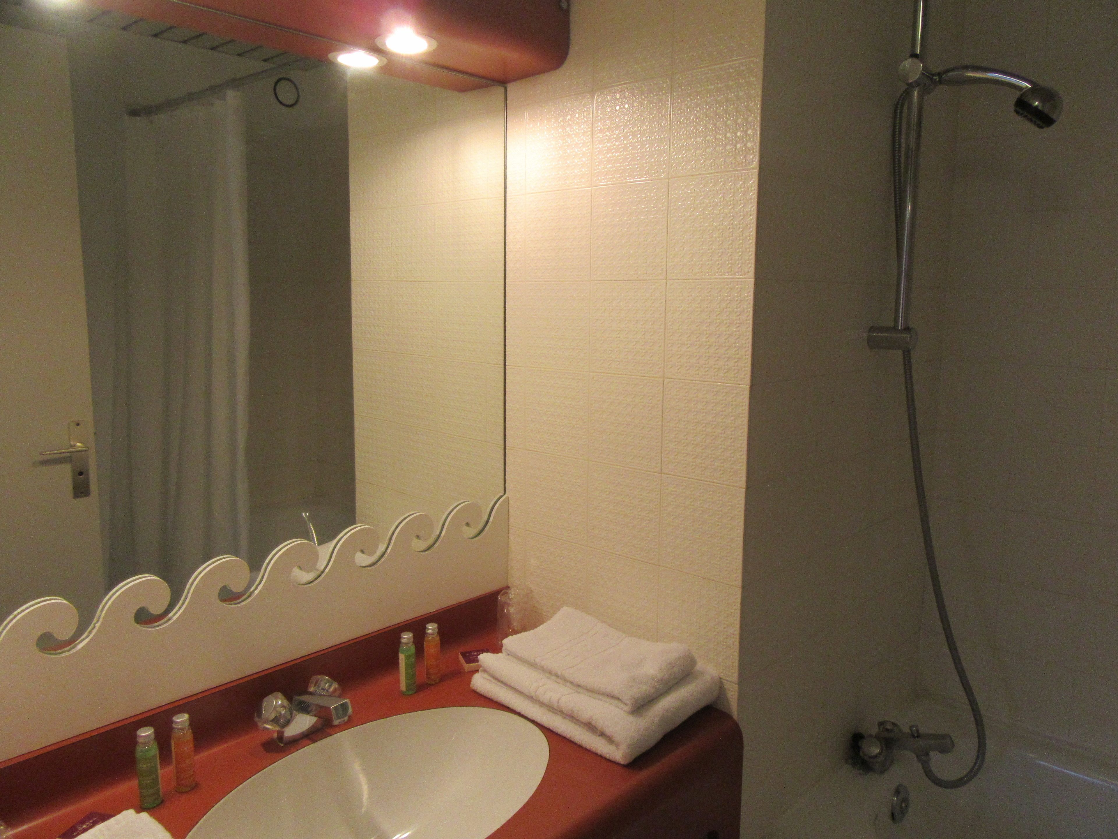 standard twin room | bathroom | deep-soaking bathtub, hair dryer, towels