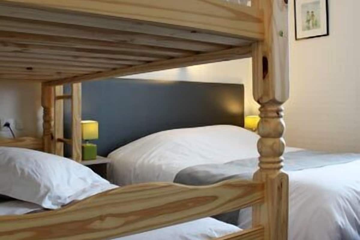 classic quadruple room | desk, blackout curtains, soundproofing, free cots/infant beds