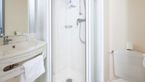 A modern bathroom with a glass-enclosed shower, a white sink, and a toilet. - Hotel & Residence Calais Car Ferry (Calais)