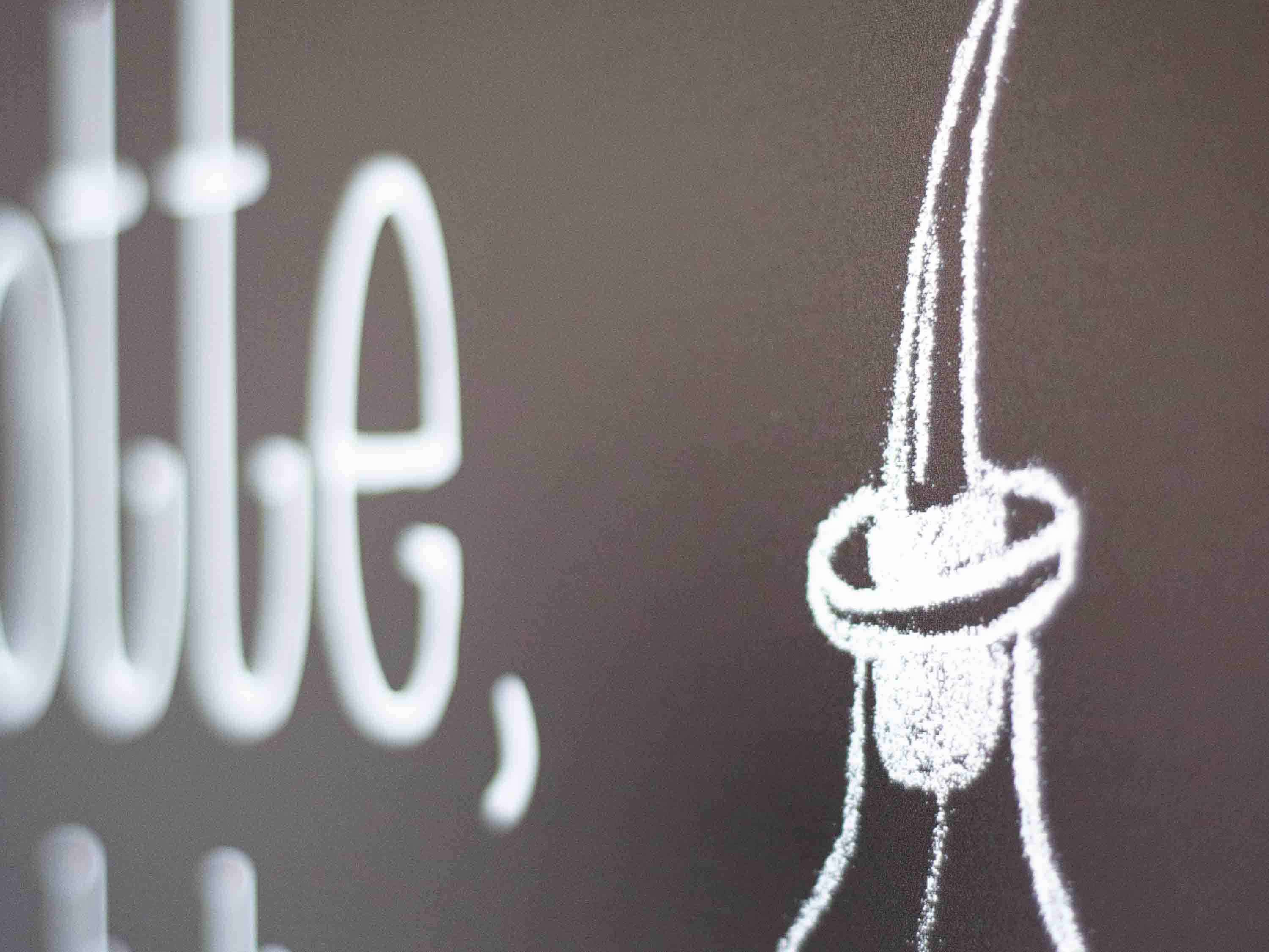 A chalk drawing of a light bulb on a blackboard.