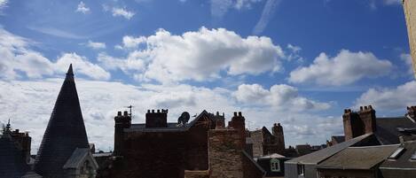 A historic town with a prominent church spire and traditional brick buildings.