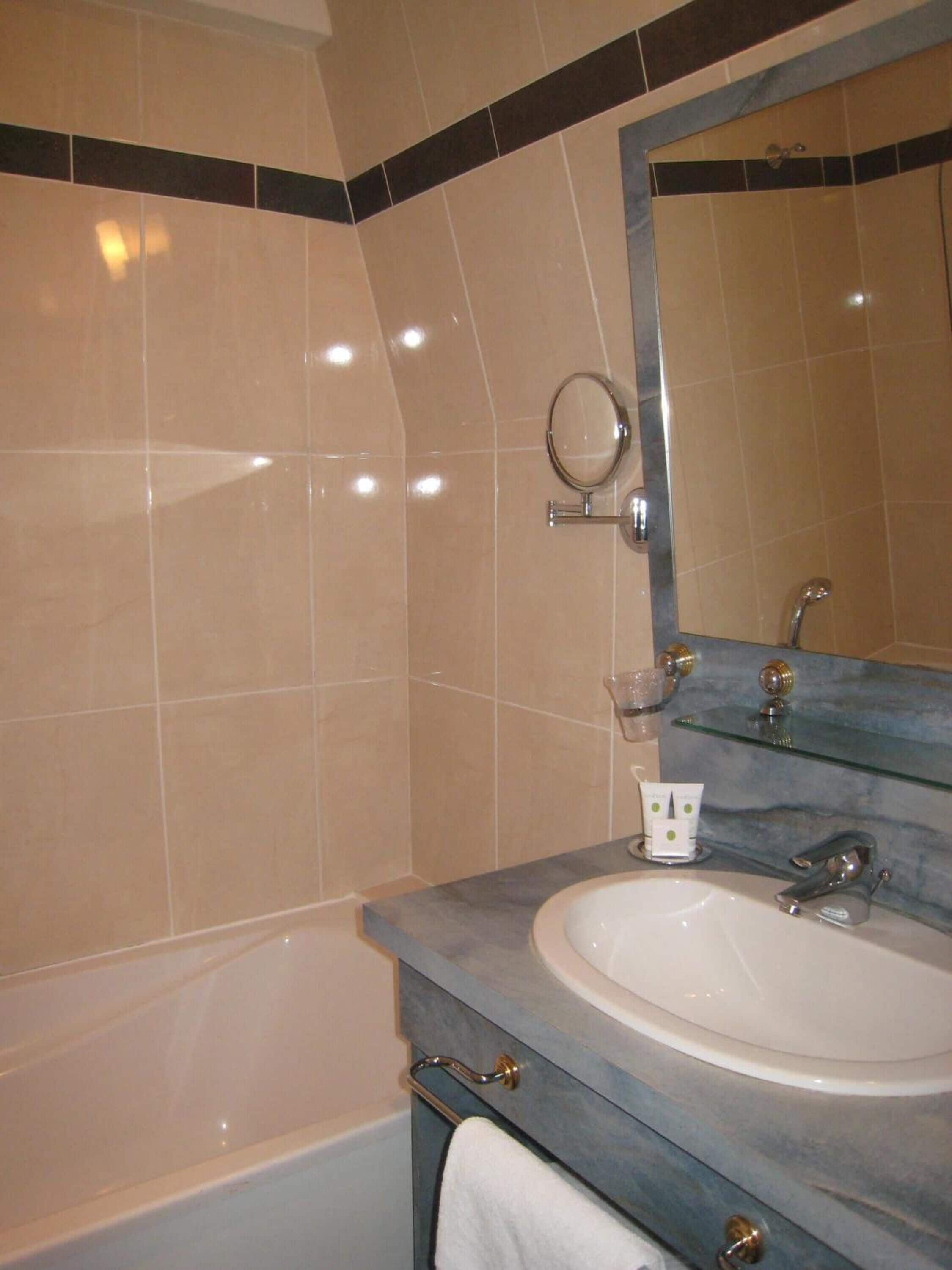 bathtub, free toiletries, hair dryer, towels