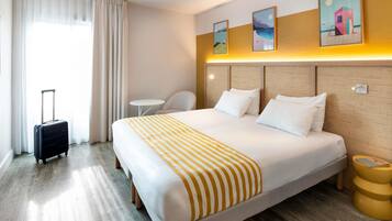 Premium bedding, in-room safe, blackout drapes, soundproofing