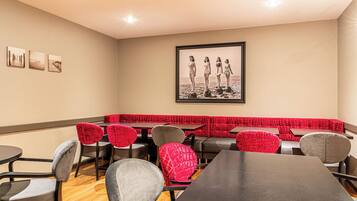 Enjoy meals in this stylish dining area with a long table, comfortable chairs, and a cozy bench.