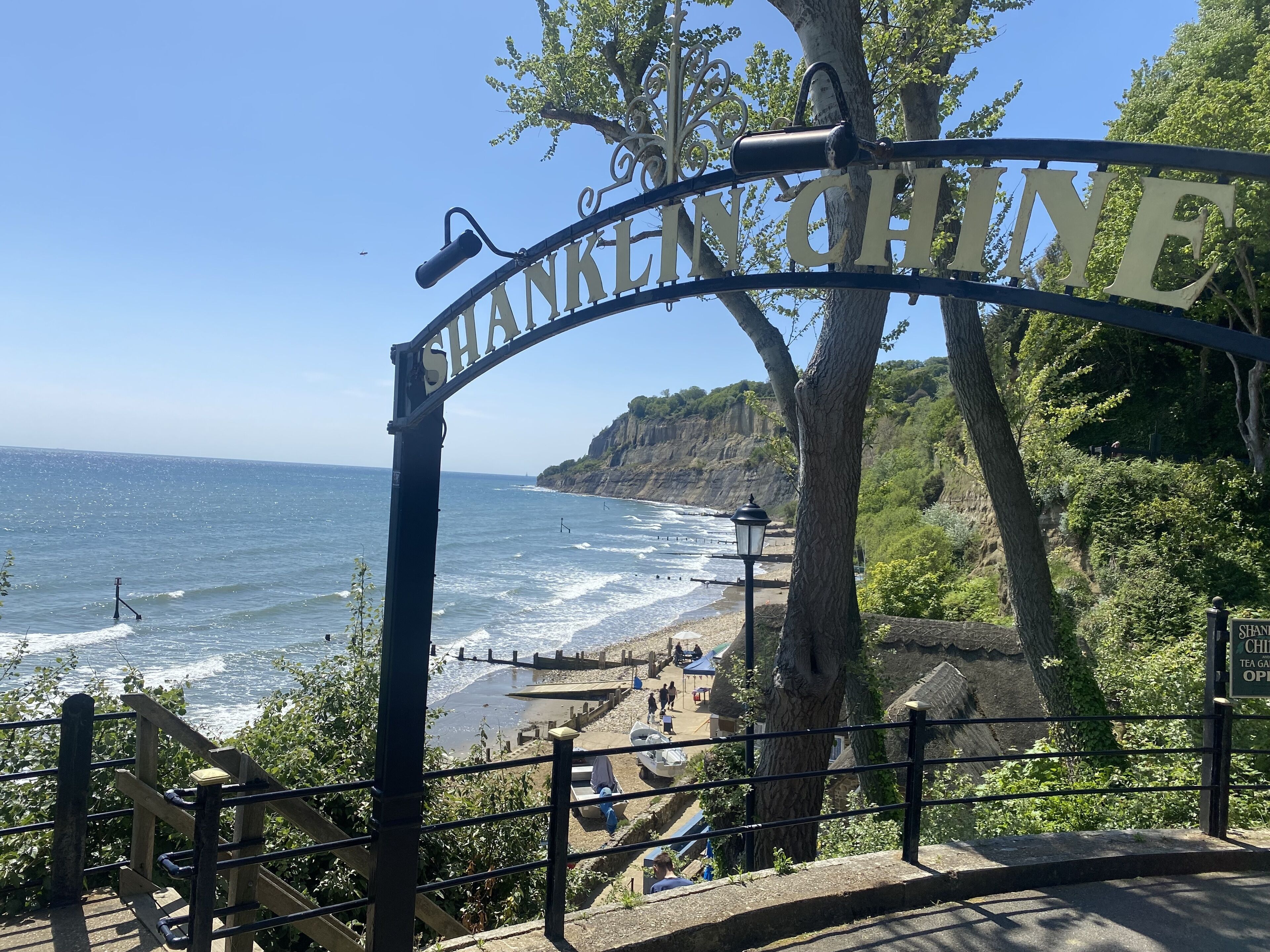 A coastal view with a sign reading "Shanklin."