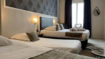 Family Room | Premium bedding, individually decorated, desk, blackout drapes