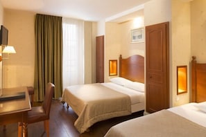 Triple Room | 1 bedroom, in-room safe, desk, blackout drapes