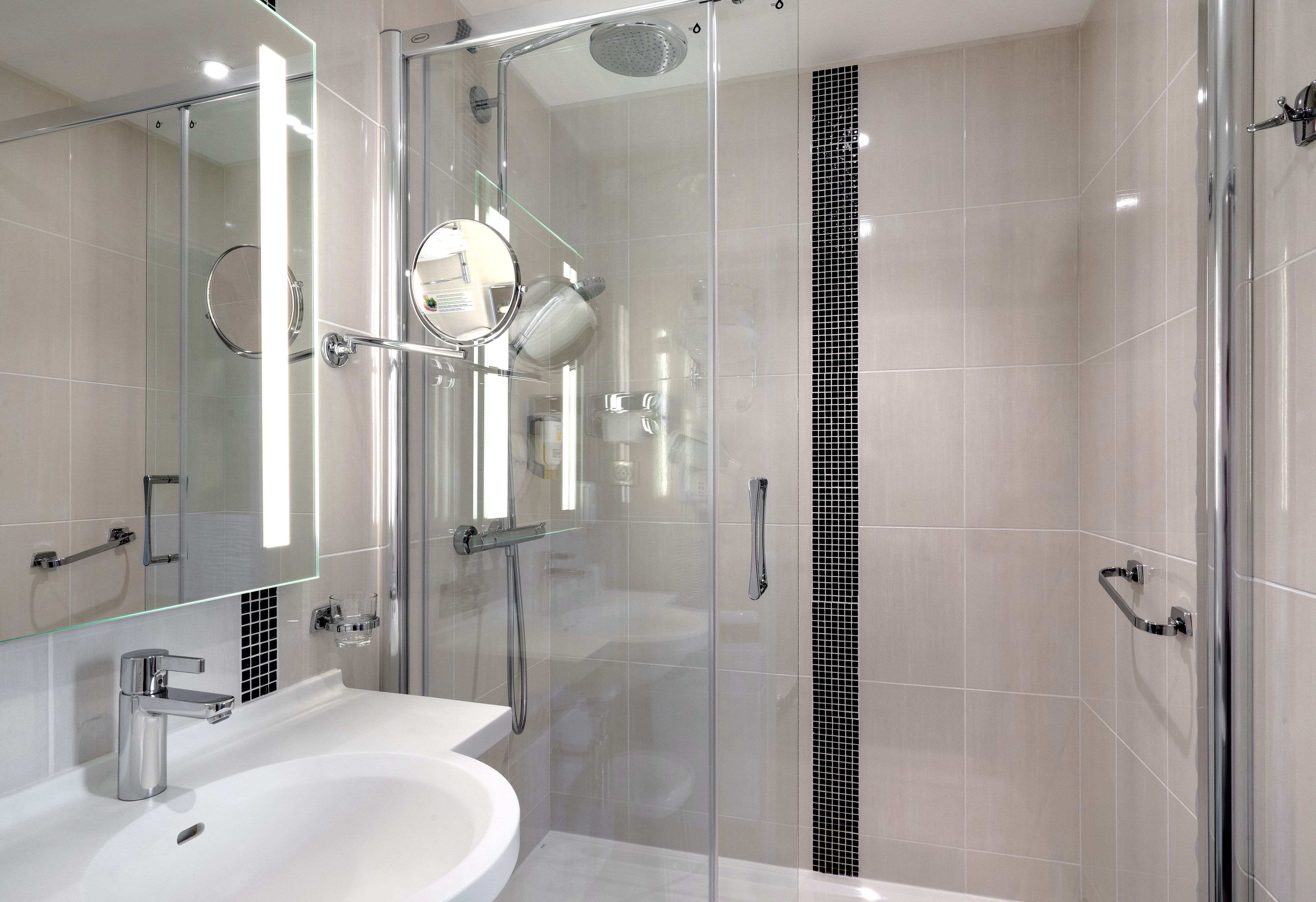 comfort plus room, 1 king bed | bathroom | shower, hair dryer, towels