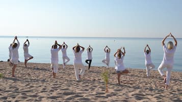 Guests can enjoy yoga sessions on the beach.
