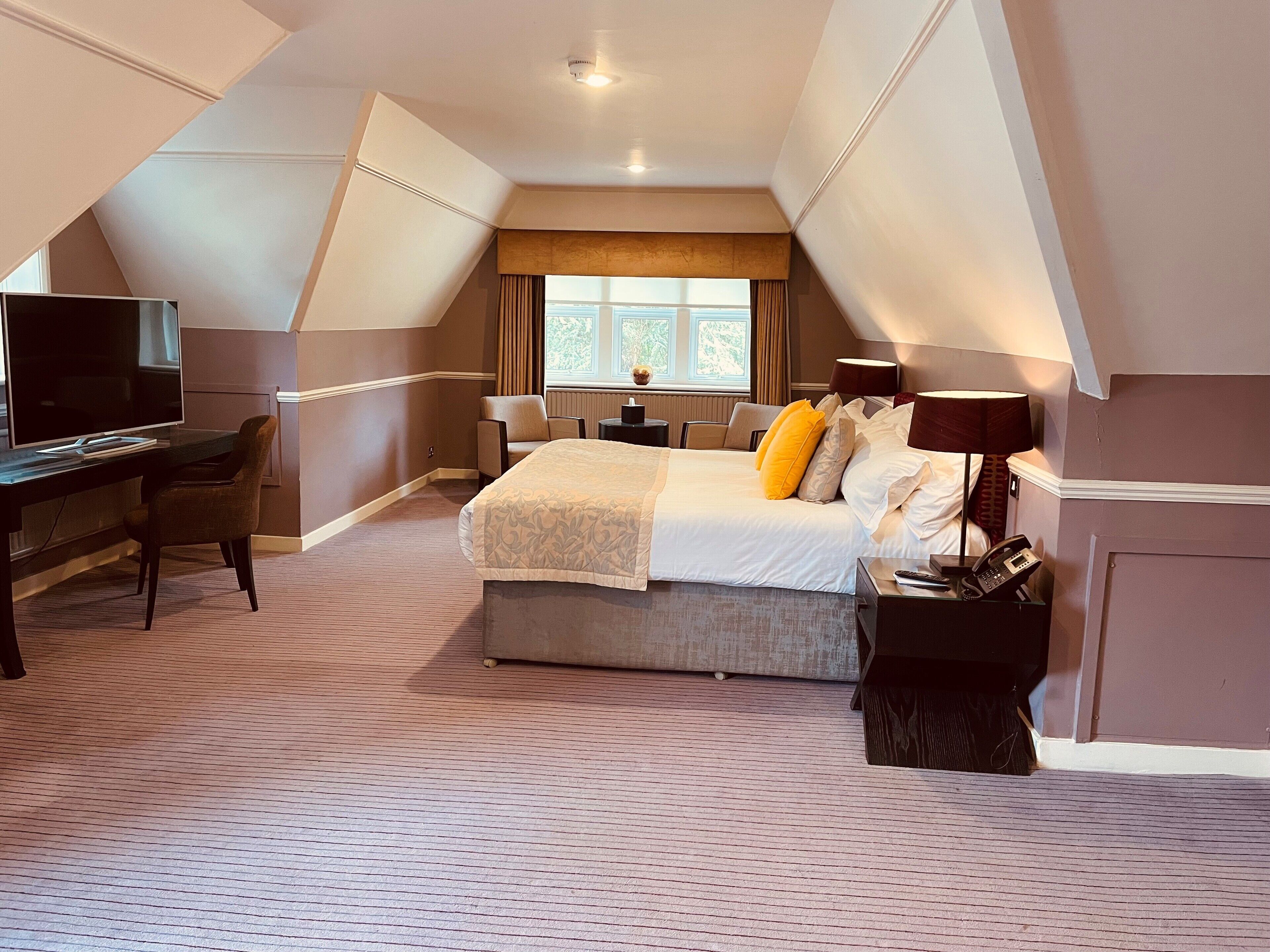 junior suite, 1 king bed, garden view | premium bedding, in-room safe, desk, laptop workspace