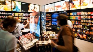 A grocery store with shelves stocked with various food items and a display of gift boxes. - As Hoteles Altube (Zuia)