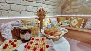 A breakfast buffet with waffles, pastries, and jams. - Alexandrine Opera (Paris)