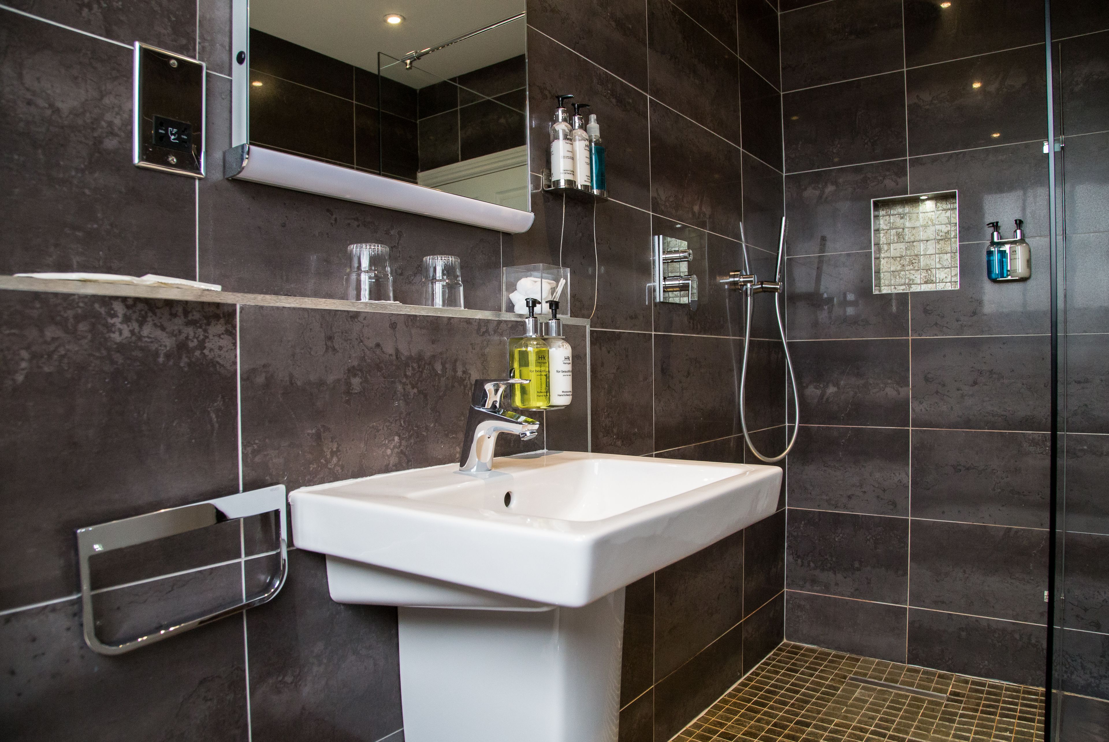 designer toiletries, hair dryer, towels, soap