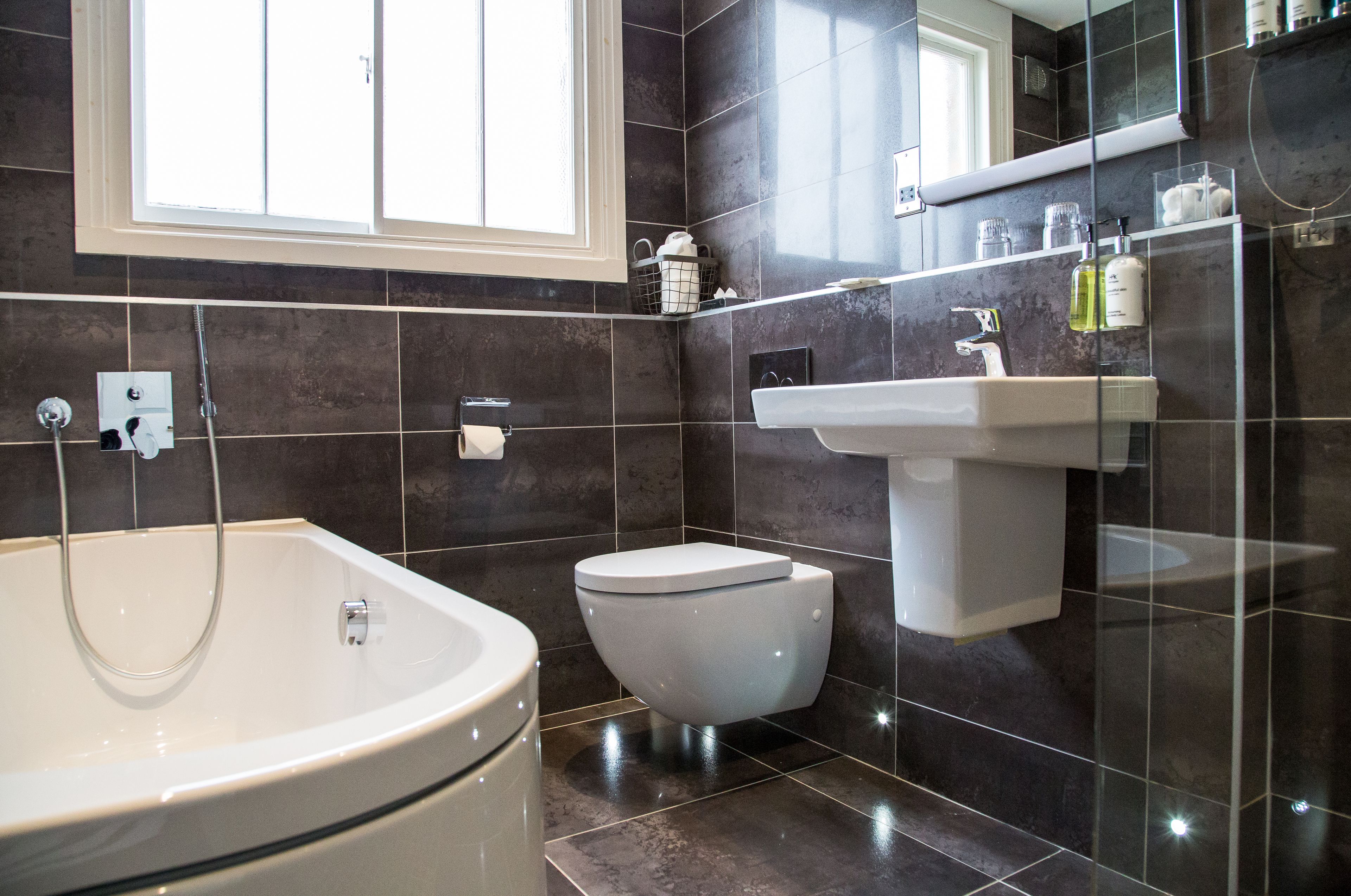 designer toiletries, hair dryer, towels, soap