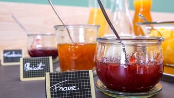 Three glass containers with straws, each labeled with a different name.