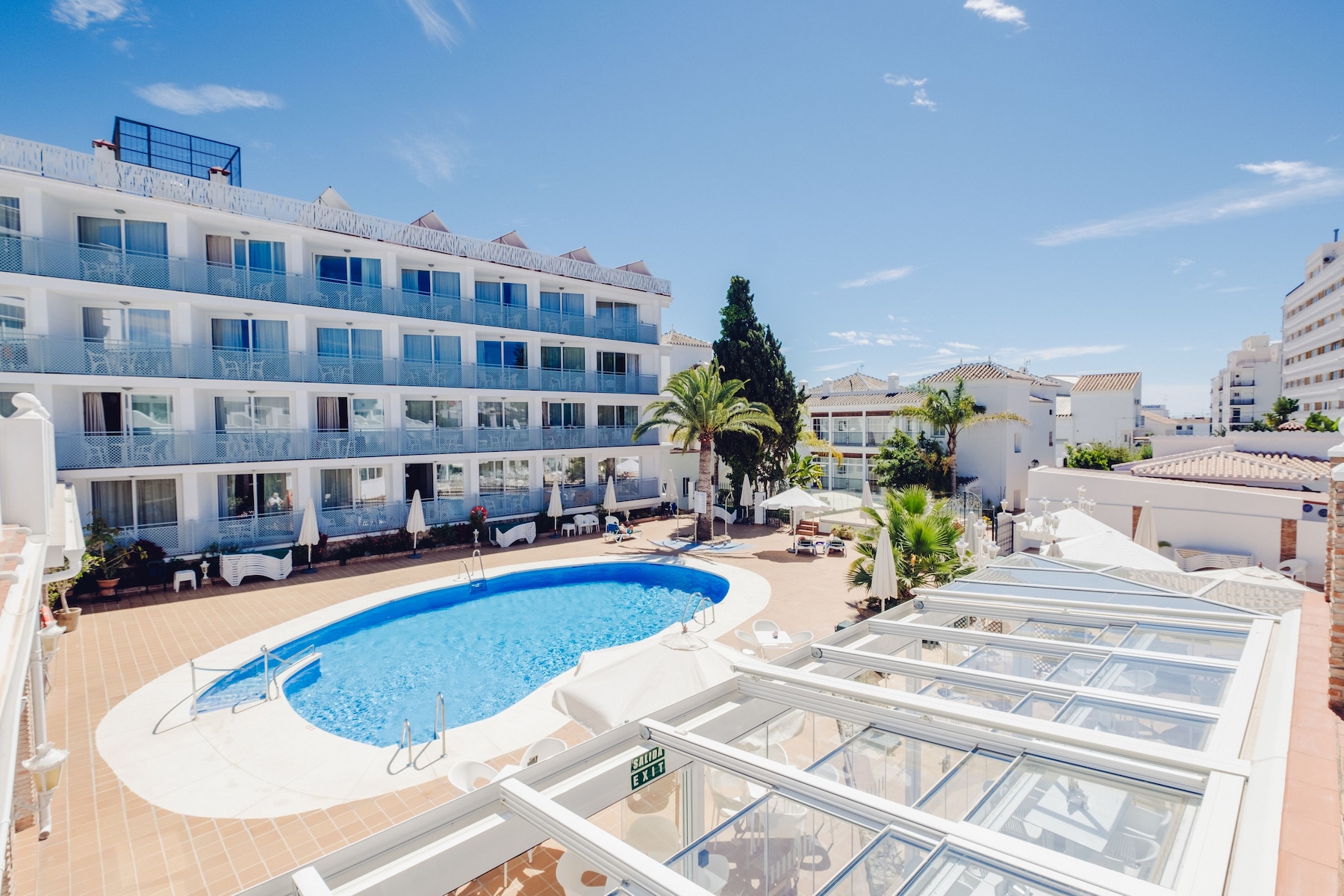 Outdoor pool, open 9:00 AM to 8:00 PM, pool umbrellas, pool loungers