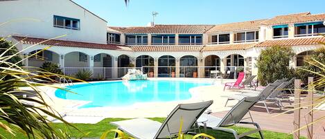 Outdoor pool, open 9:00 AM to 9:00 PM, sun loungers