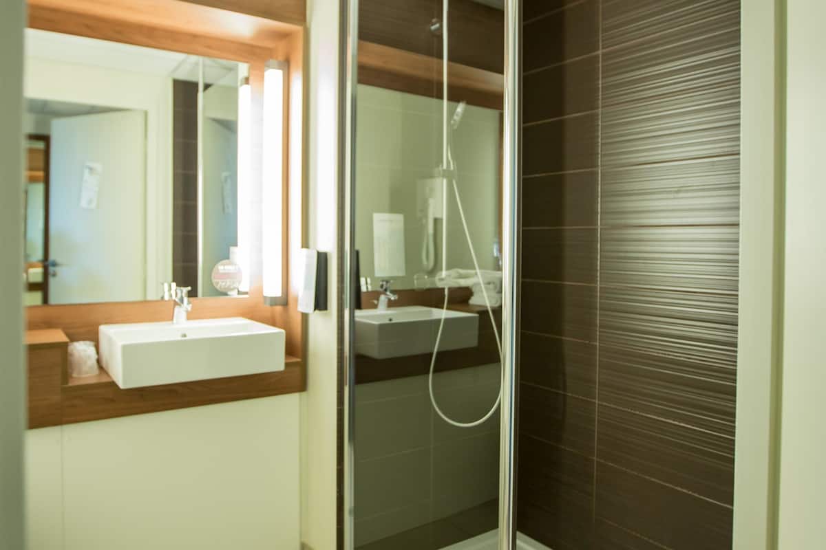 shower, eco-friendly toiletries, hair dryer, towels