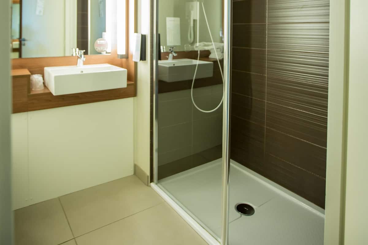 Shower, eco-friendly toiletries, hair dryer, towels