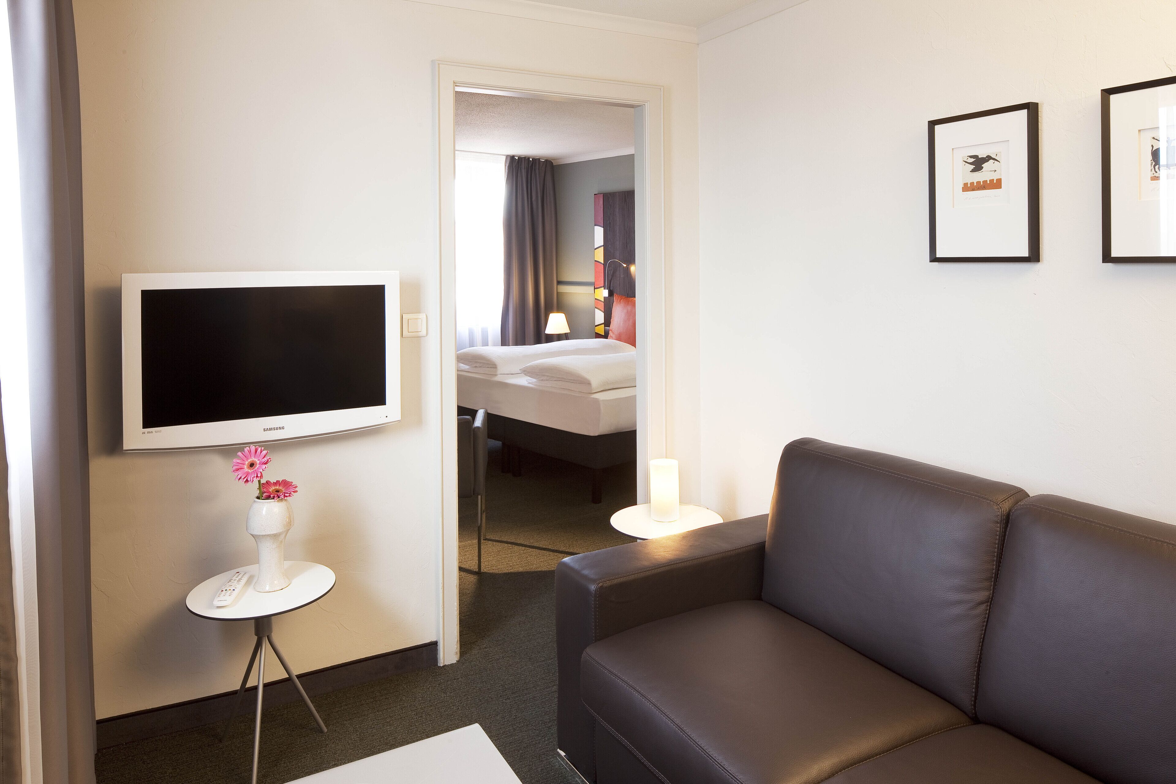 family room | 1 bedroom, premium bedding, minibar, in-room safe