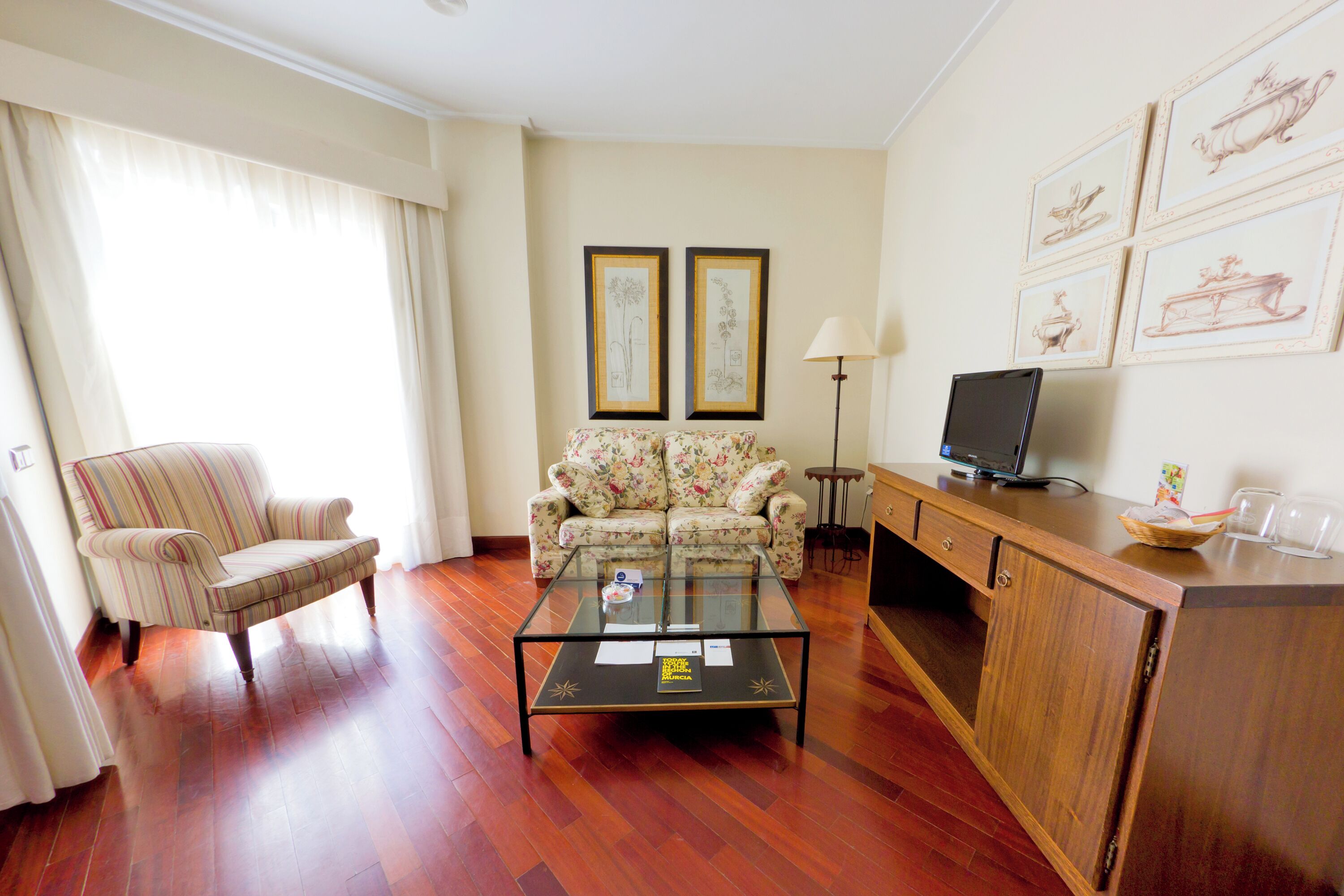 junior studio suite | living area | 32-inch flat-screen tv with satellite channels, tv, printers