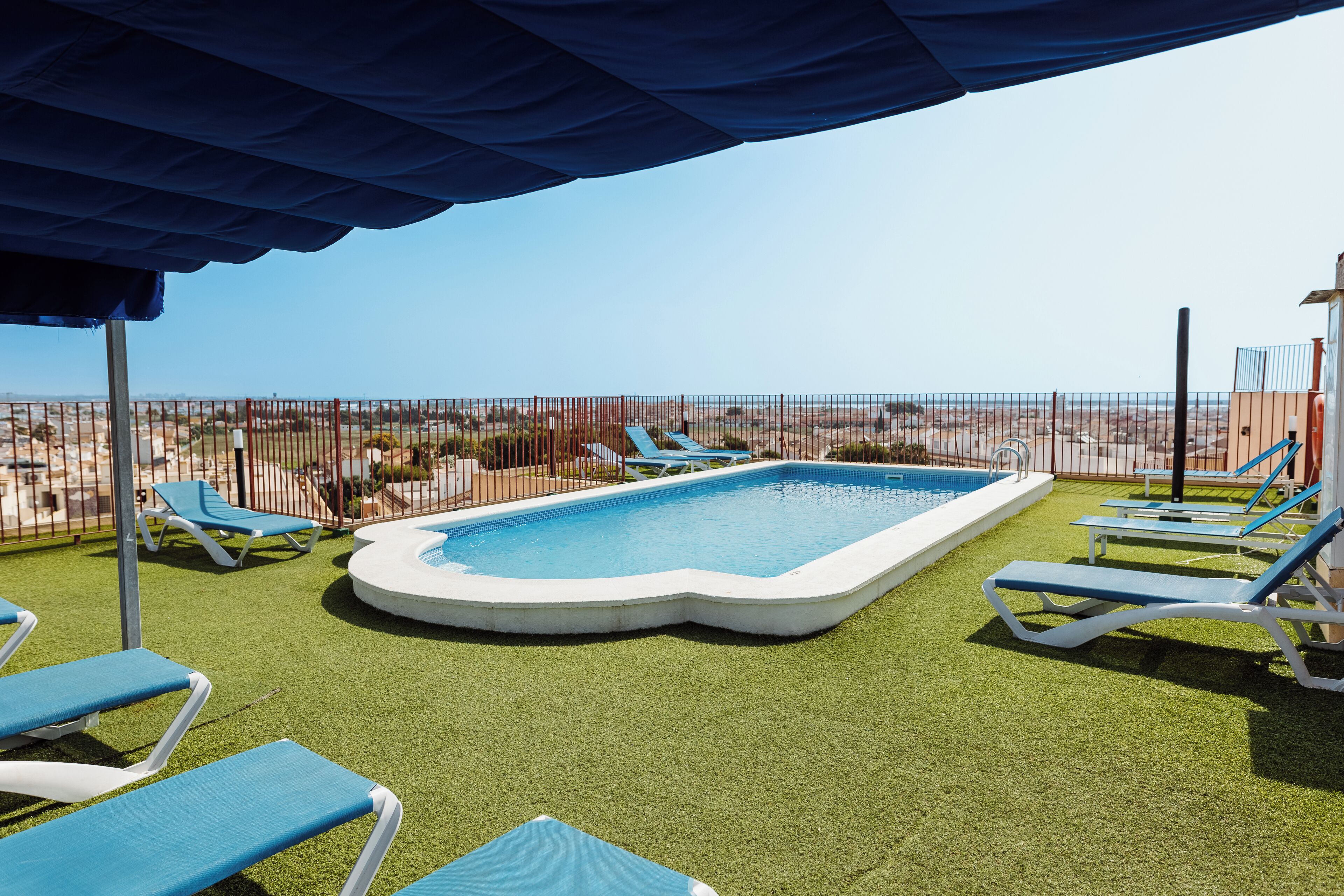 outdoor pool, open 10:00 am to 8:00 pm, pool umbrellas, pool loungers