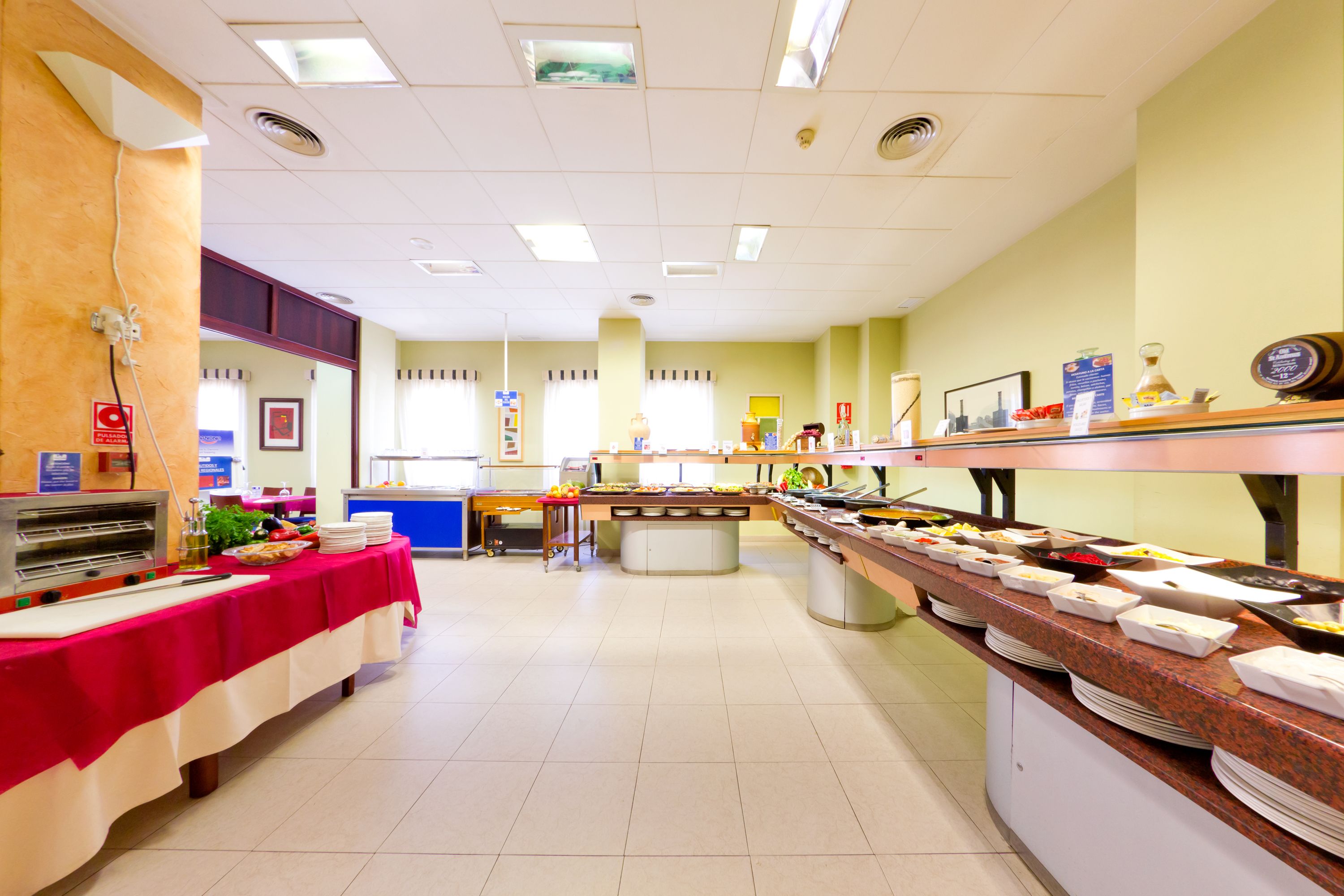A buffet setup with multiple food stations and a central serving area.