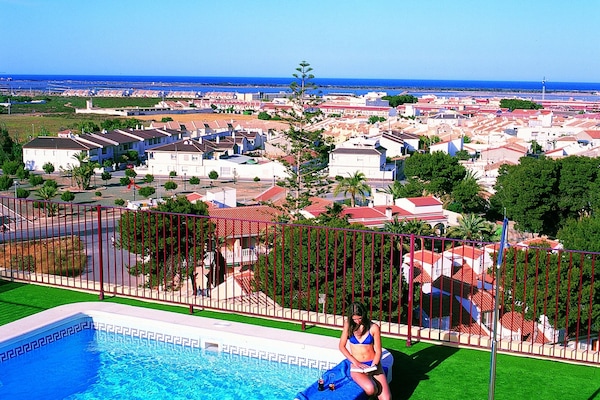 Outdoor pool, open 10:00 AM to 8:00 PM, pool umbrellas, pool loungers