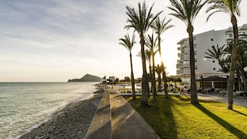 On the beach, sun loungers, beach towels