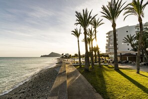On the beach, sun loungers, beach towels