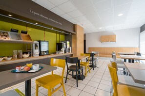 Enjoy dining in a stylish, well-appointed space with tables, chairs, and modern amenities.