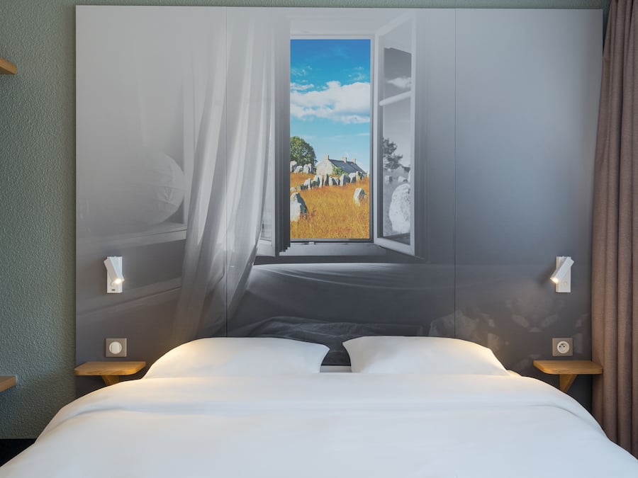 Premium bedding, desk, laptop workspace, blackout drapes