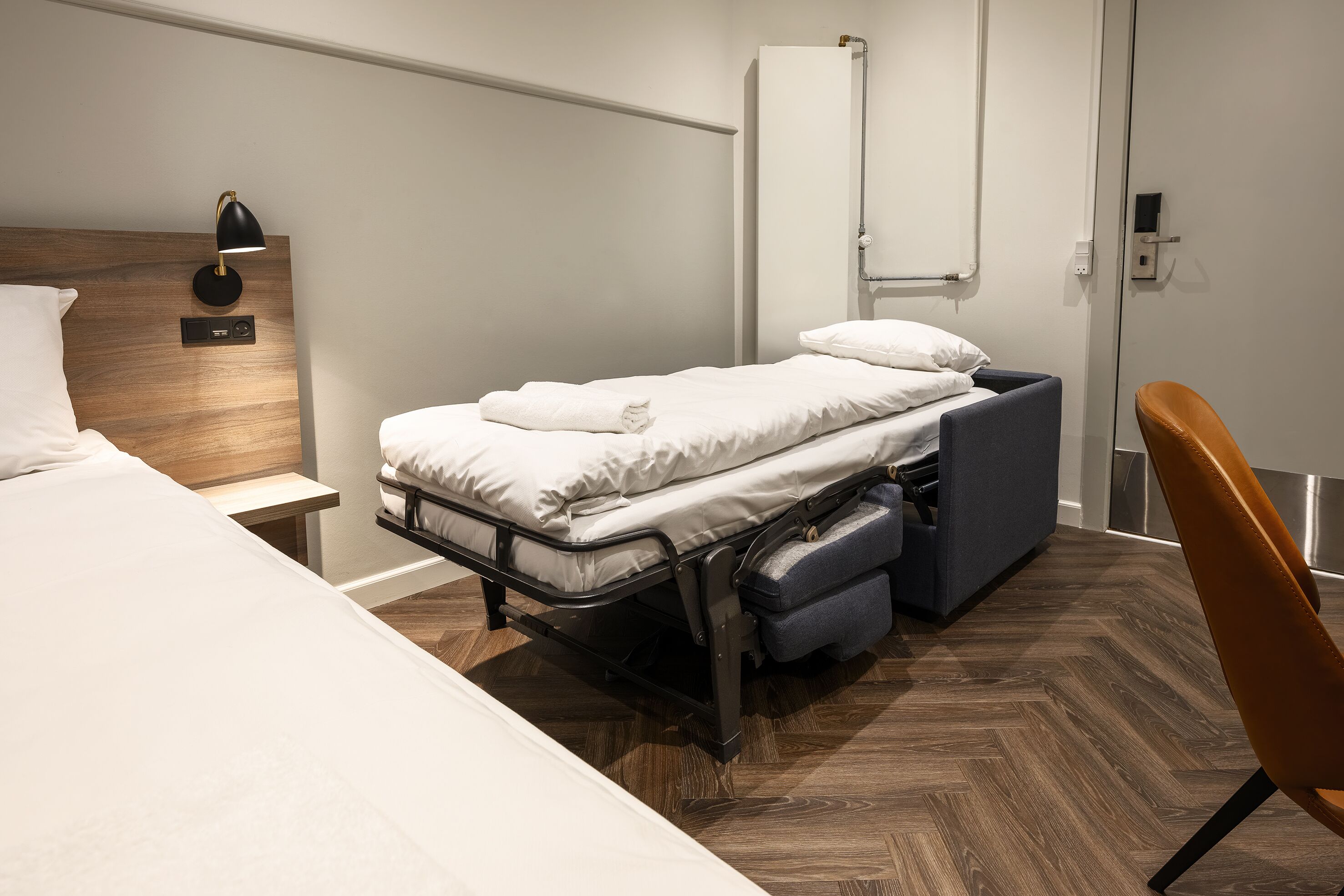 economy triple room, shared bathroom (single beds) | 1 bedroom, desk, iron/ironing board, free wifi