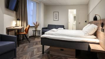 Standaard vierpersoonskamer, privébadkamer (Single Beds) | Een bureau, een strijkplank/strijkijzer, gratis wifi, beddengoed