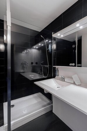 Shower, hair dryer, slippers, towels