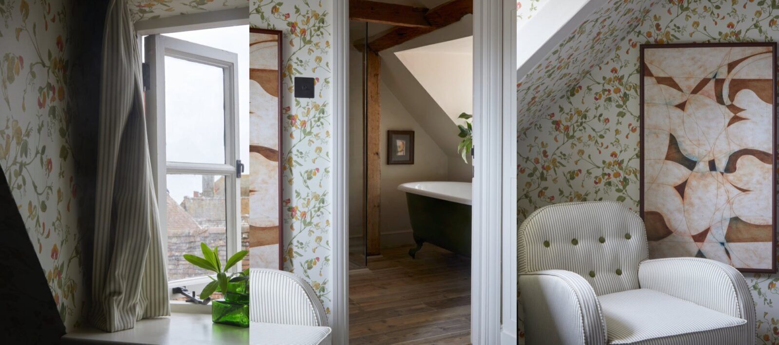 A room with floral wallpaper, a dining table with a chair, a green plant, and a framed artwork on the wall.